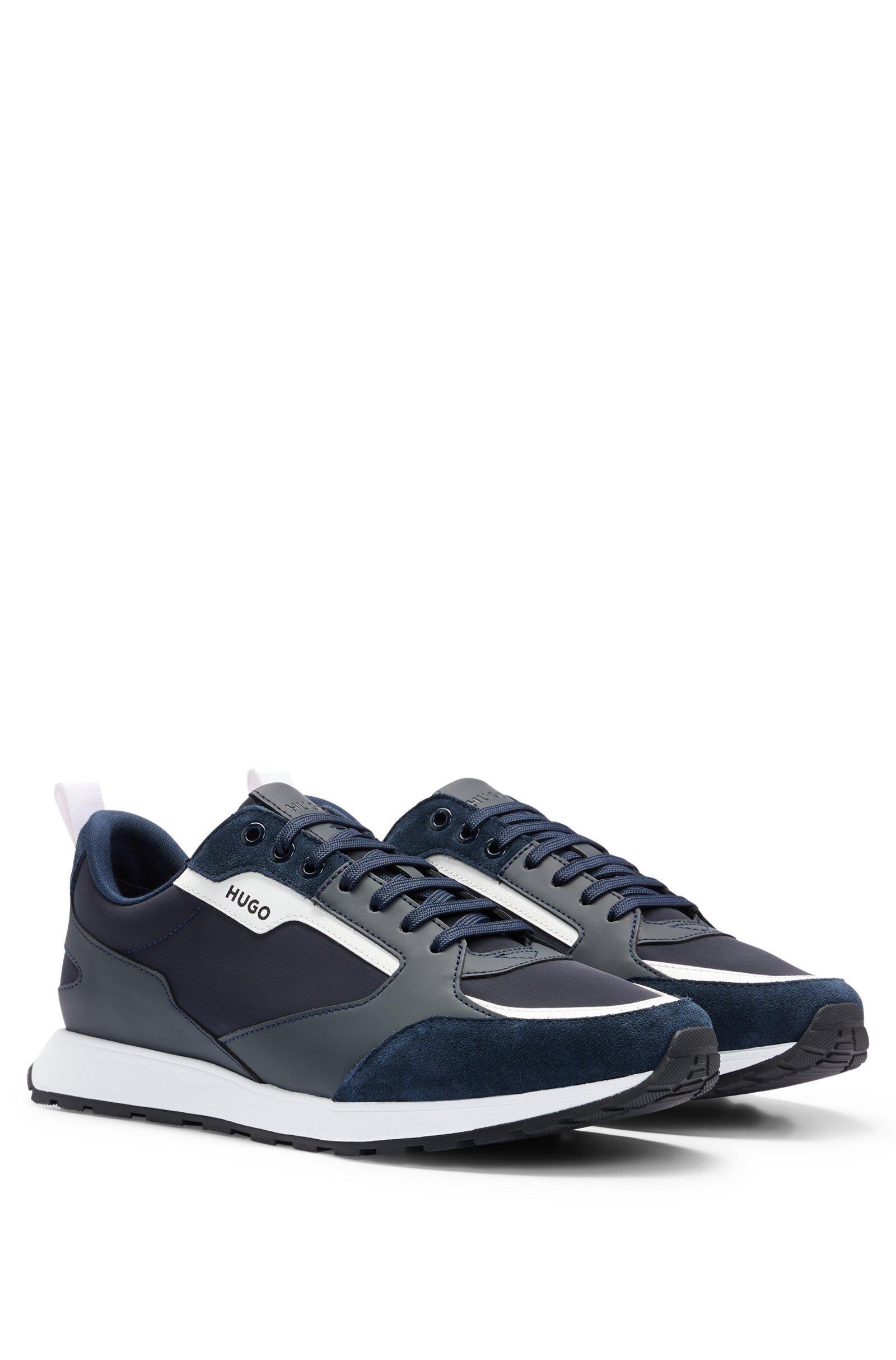 Sneakers HUGO Boss low top , blu con contrasti bianchi . La scarpa u00e8 realizzata   con una combinazione di materiali quali pelle scamosciata 