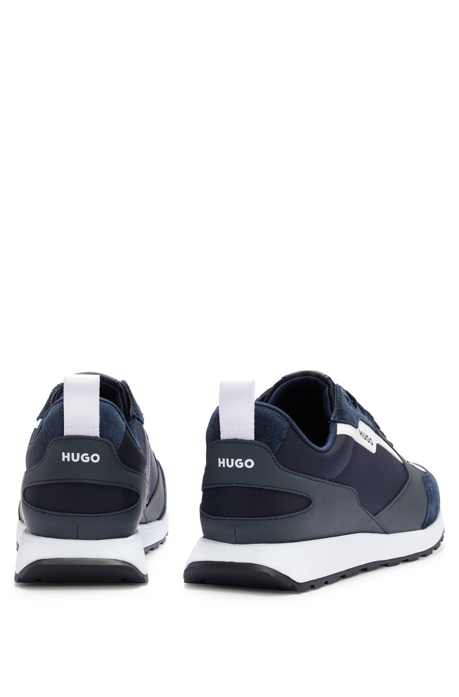 Sneakers HUGO Boss low top , blu con contrasti bianchi . La scarpa u00e8 realizzata   con una combinazione di materiali quali pelle scamosciata 
