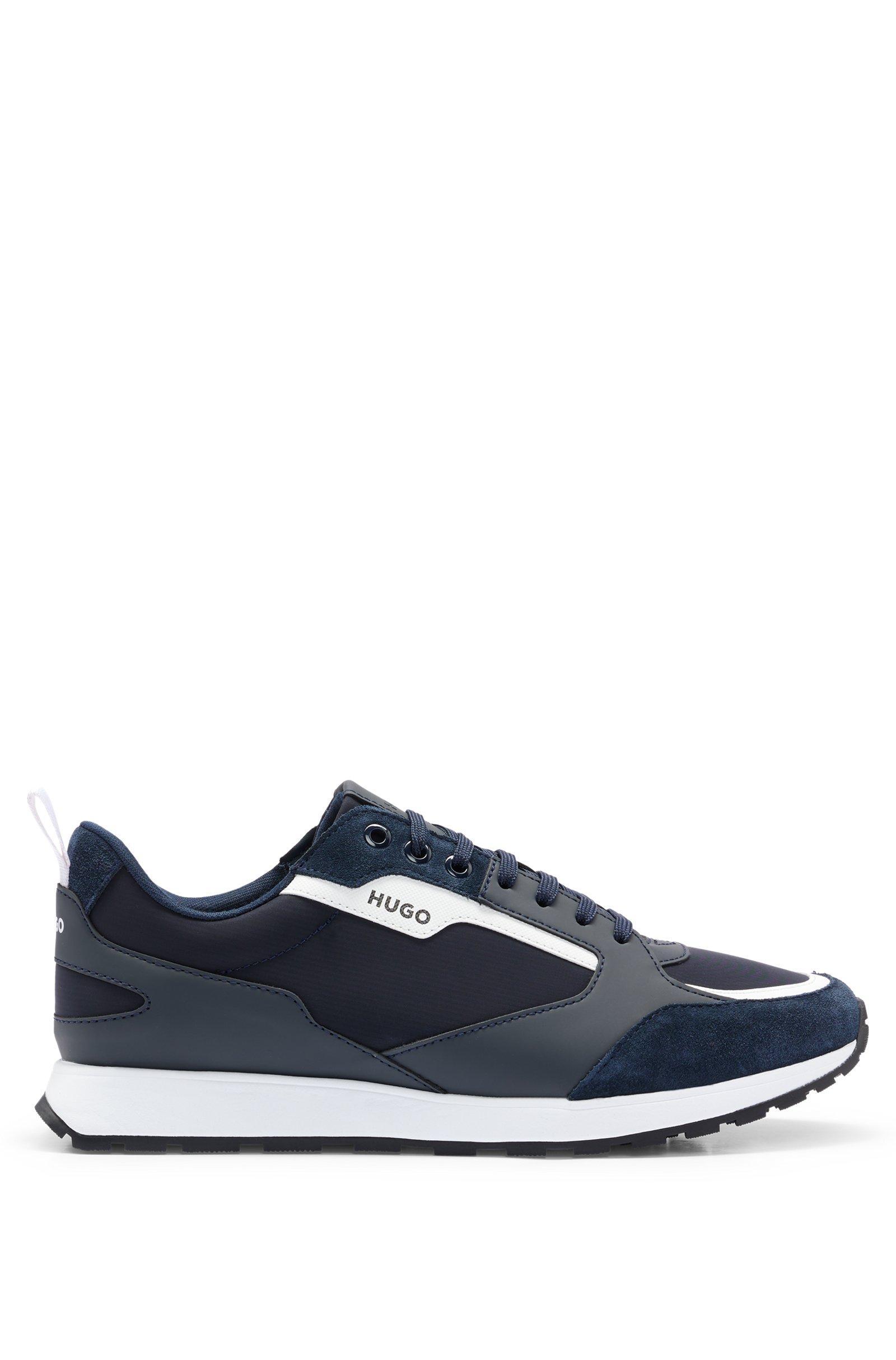 Sneakers HUGO Boss low top , blu con contrasti bianchi . La scarpa u00e8 realizzata   con una combinazione di materiali quali pelle scamosciata 