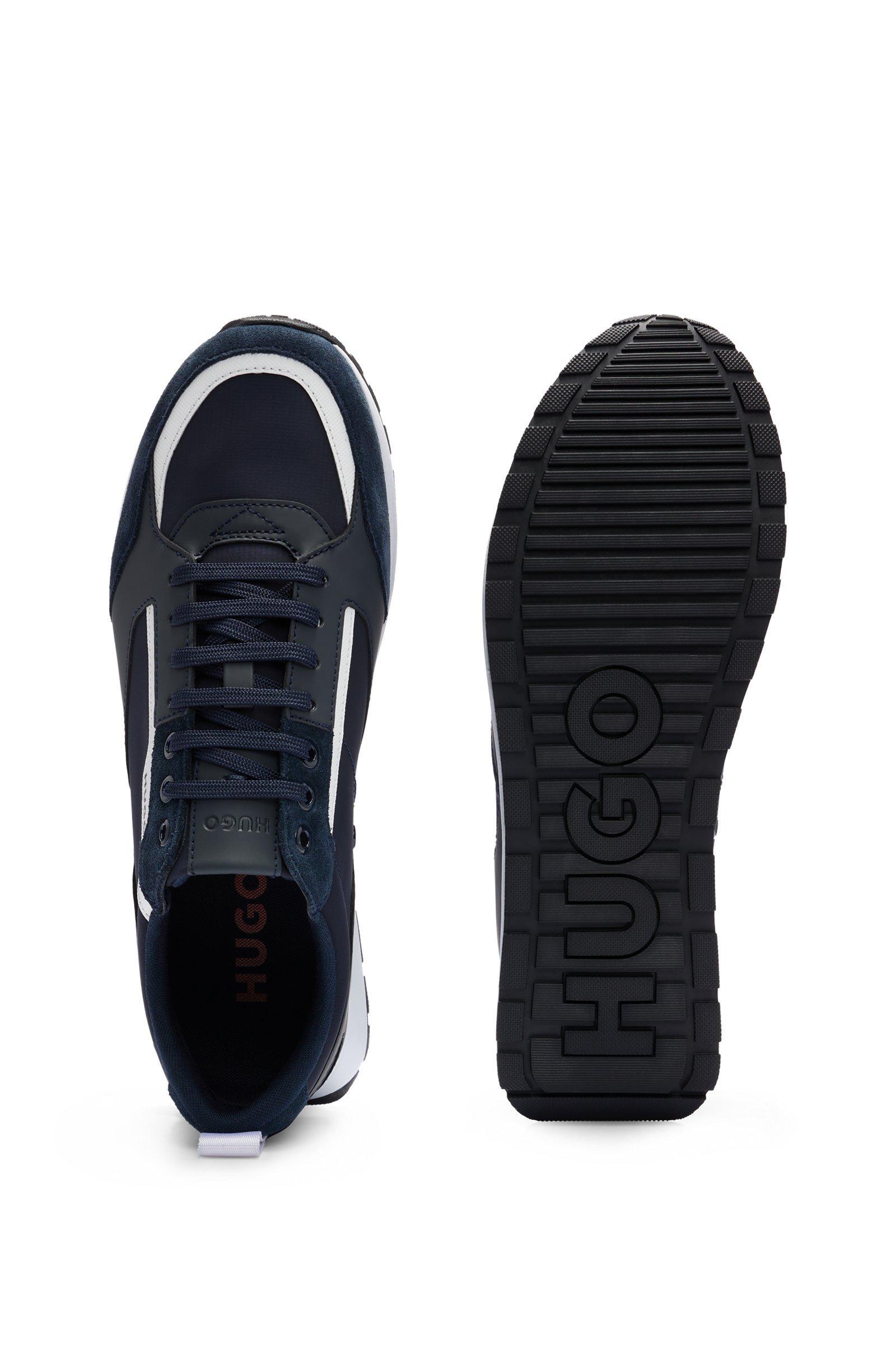 Sneakers HUGO Boss low top , blu con contrasti bianchi . La scarpa u00e8 realizzata   con una combinazione di materiali quali pelle scamosciata 