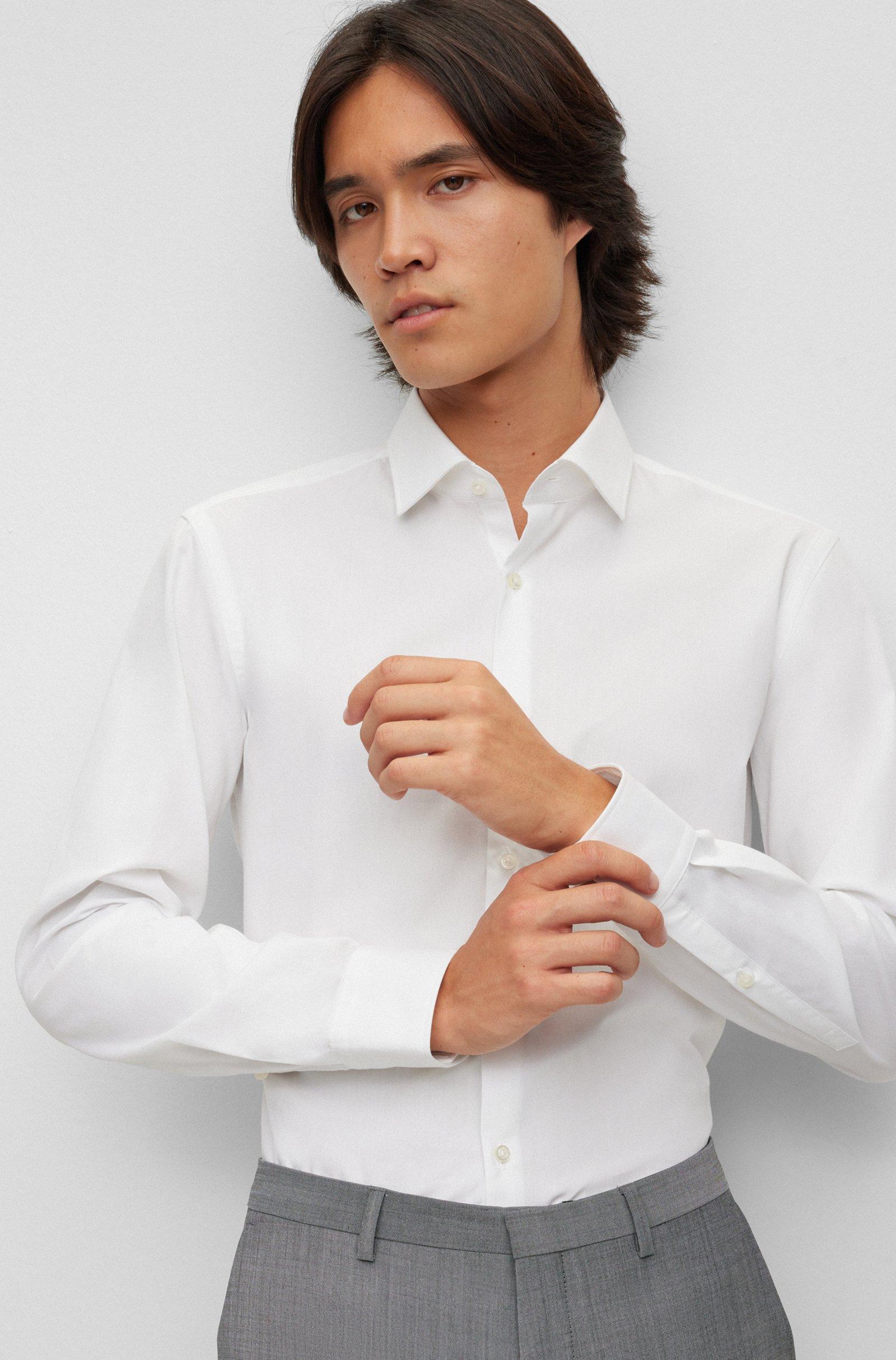 Camicia HUGO Boss Bianca , manica lunga. Tessuto in cotone Popeline molto gradevole e morbido sulla pelle ,ottimo per una facile stiratura
